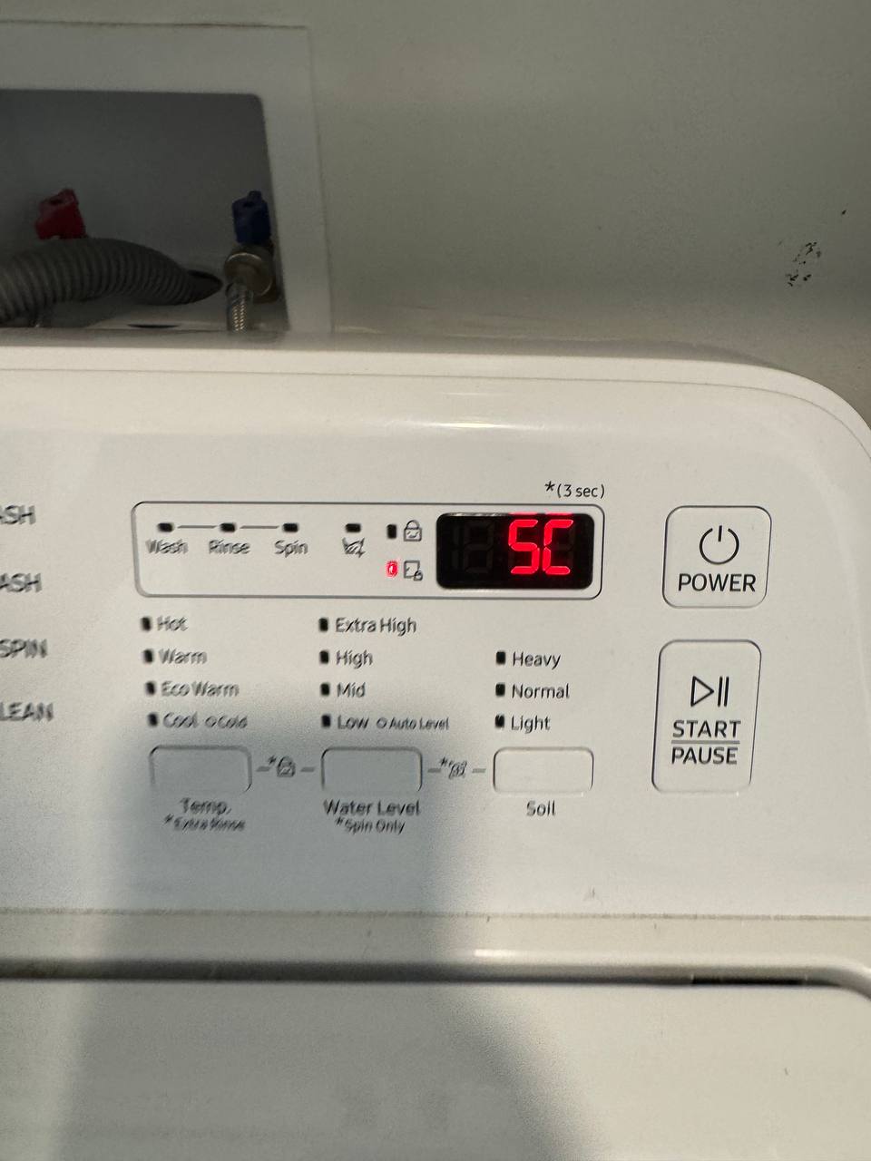 Samsung top-load washer control panel showing a 5C drain error code with the water-supply valves visible behind, photographed during an Express Xpert washer drain pump repair in Coral Gables, Miami-Dade County, FL
