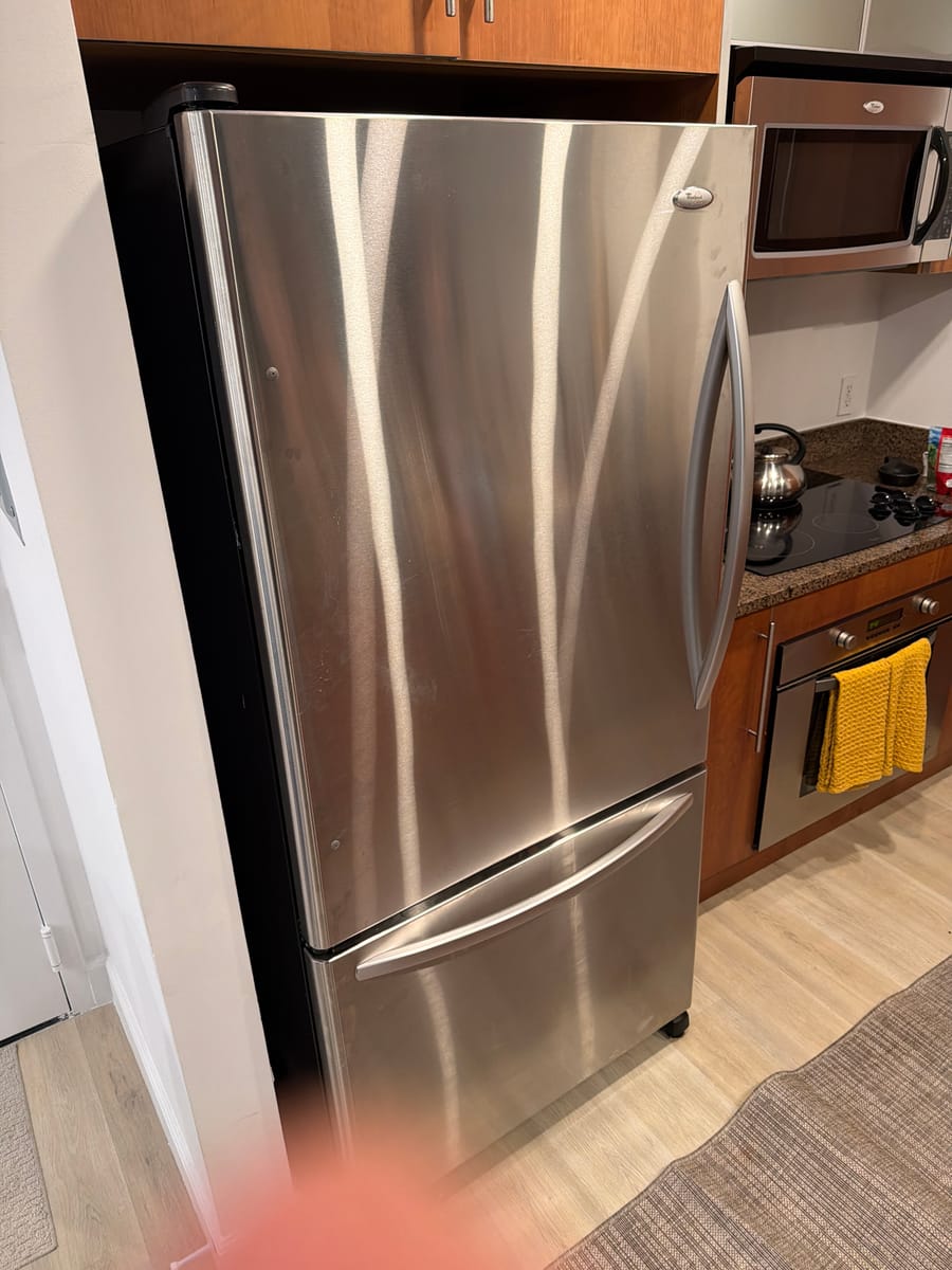 Stainless steel refrigerator repaired by Express Xpert in Broward