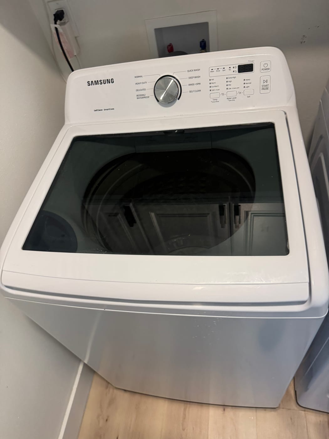 Samsung washing machine serviced by Express Xpert in a Miami-Dade laundry room