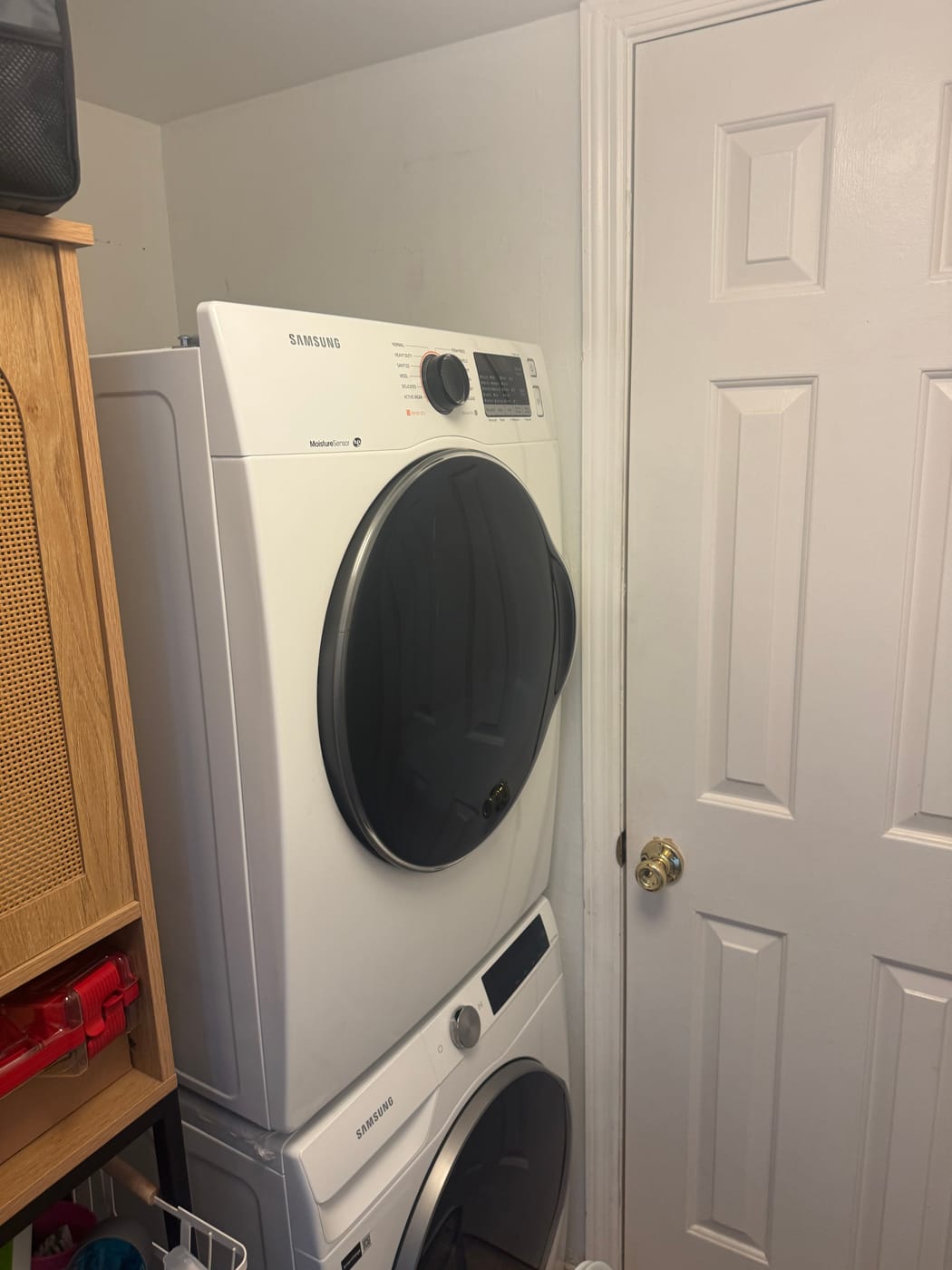 Stacked front-load washer and dryer serviced by Express Xpert in a Palm Beach County home
